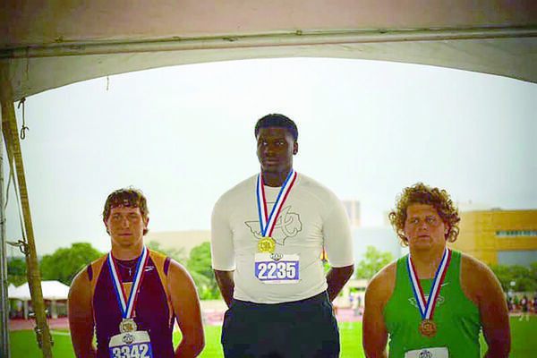 Courtesy photo
Alto Yellowjacket Fred Thacker, center, wins the gold in State track and field events.
