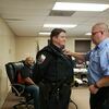 Shawn Solly, Rusk Police Department’s newest officer, is pinned by her husband Phillip, during an Oct. 14 Rusk City Council meeting.

Photo by Jo Anne Embleton