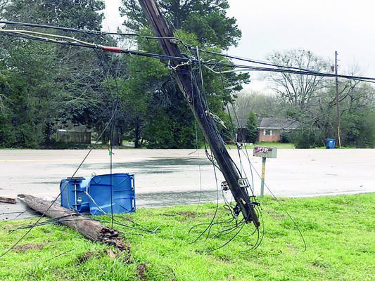 Utility poles were the only casualties of the accident in which traveling industrial equipment pulled down utility wires along U.S. Highway 69.