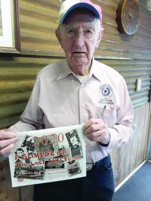 Shelley ‘Shamrock’ Cleaver shows off this year’s historic pictorial calendar featuring Cherokee County lore.
