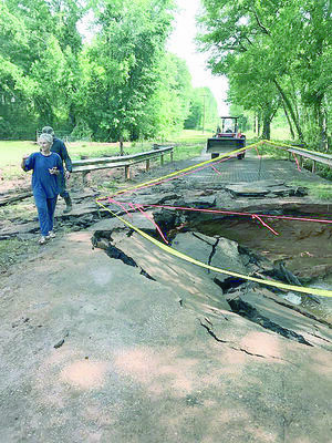Cherokee County Precinct 2 crewmen did major repairs to a county road recently, after severe weather and flooding destroyed the road’s surface and bridge