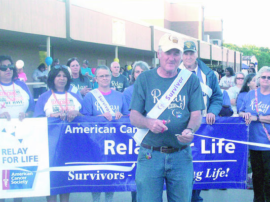 Longtime Relay volunteer and cancer survivor Jay Hooker cuts the ribbon, officially kicking off the 20th annual Cherokee County Relay for Life event on Friday, April 27.