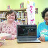 Wednesday Study Club projects committee chair Susan Jackson and Jacksonville Public Library director Trina Stidham show off first prize in the annual Study Club raffle, a 14-inch laptop. Tickets are available until April 8 at the Jacksonville Public Library or by calling Ms. Jackson at (903) 284-1139.
