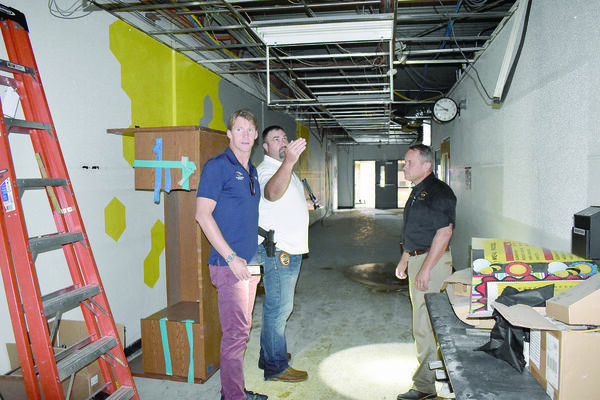 Alto ISD board member Jed Morris and Alto Police Chief Jeremy Jackson showed Josh Davis parts of the now unusable high school building. The building took significant damage during the bout of tornados that hit Alto on April. 13.