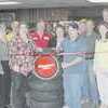 Jody Gray of Gray's Automotive cuts the ribbon during festivities March 22 welcoming the business into the Rusk Chamber of Commerce. On hand to welcome chamber members were Mr. Gray's mother, Rebecca and his wife, Amanda. Holding the ribbon are Chamber President Penny Reynolds and Chamber Executive Director Bob Goldsberry. PHOTO: TARA CROSBY
