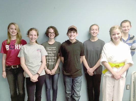 From left to right Livia Sessions, Madisyn Foster, Kennedy Foster, Noah Foster, Ella Kovacs, Laurie Gentry, and Meg Kovacs. Not pictured are John Wofford, Kara Wofford, and Sarah Wofford.