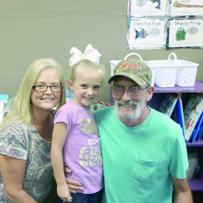 Chloe Devries, center, with her grandmother Michelle Hall and great-grandfather Michael Dominy, all of Rusk.