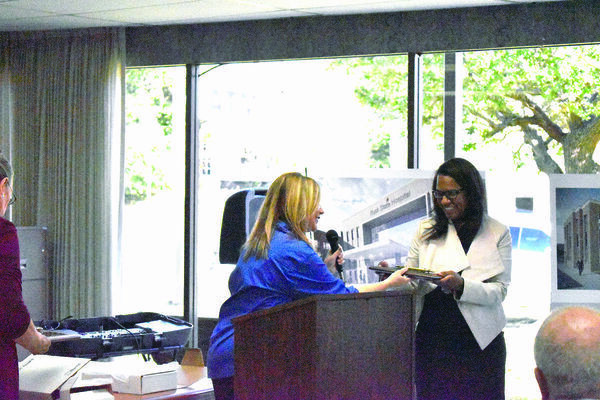 Rusk Mayor Angela Raiborn, left, presents a key to the city of Rusk to HHS Executive Commissioner Dr. Courtney N. Phillips.