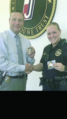 The Jacksonville Police Department would like to congratulate JPD Officer Jennifer Gillham, shown at right, on her recent promotion to corporal. Also shown is Jacksonville Police Chief Andrew Hawkes.