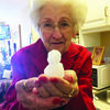 Angelina House resident Melba Darrow shows off her snowman. A number of residents took part in the event and enjoyed the winter weather with their mini-snowman friends.