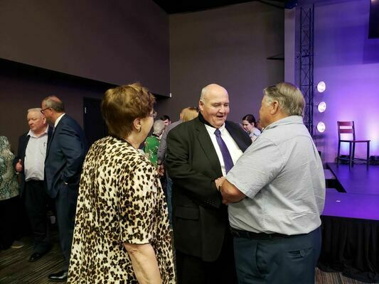 Outgoing Jacksonville College President Dr. Mike Smith enjoys a visit with a well-wisher at his reception May 8 at Central Baptist Church. 

Photo by Jo Anne Embleton