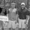 The Rusk Rotary Club's annual Memorial Golf Tournament at Birmingham Forest Golf Course in Rusk was reportedly a huge success. Toni Meador (left) handed out a prize of $500 to the first place team consisting of Pat Richey, Pax Richey, Brian Raiborn, and Jamie Magruder. This year enough money was raised to fund five scholarships.