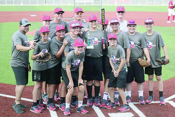 Courtesy Photo
Bullard 12U state championship team member Lex Rich (center, holding trophy), shown with his teammates and coach, won the homerun derby which took place just prior to the Dixie World Series. Dustin Wynne served as pitcher for Rich who shows off his award as the team celebrates his win.