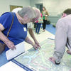 Photo courtesy Penny Hawkins
Jacksonville area resident peruse maps and information regarding the Texas Department of Transportation’s proposed routes to take U.S. Highway 69 around the city during a meeting held last week at the Norman Activity Center in Jacksonville.