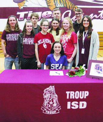 Courtesy Photo
TISD athlete Emily Neel, pictured with her teammates, on National Signing Day.