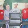 Texas National Bank on North Main street in Rusk recently celebrated "Customer Appreciation Day" by serving free hotdogs and drinks to their customers. Pictured are Toni Meador, Saundra Senesac, Sam Senesac and Lewie Byers. Mr. and Mrs. Senesac were the winners of the gas grill which was given away at the celebration.