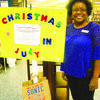 Jacksonville Library Director Trina Stidman shows off the Christmas in July kiosk at the Jacksonville Library, which benefits the county’ abused or neglected children.