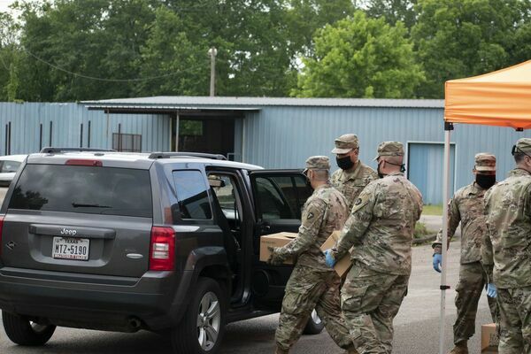 Photos by Josie Fox
Members of the National Guard load up a vehicle with foodstuffs during a special all-inclusive food distribution event held Wednesday, May 13 at the Good Samaritan in Rusk, in conjunction with the East Texas Food Bank.