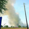 This photo, captured by Stella Trent, shows a large plume of smoke arising in the distance in Mixon. The Jacksonville Fire Department battled a large fire in Mixon on Wednesday afternoon. Fire Chief Paul White said the department fought the fire into Thursday morning and all houses threatened were saved.