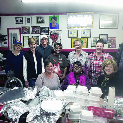 Courtesy photos
Jacksonville restaurant owner Sylvia Mae, center, gets a snapshot with several happy diners recently.