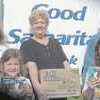Good Samaritan President Kay Epperson and Food Bank Manager Dolly Lofton accept delivery of Girl Scout Cookies from left, Myles Inglish, Libby Berry and Moira O'Heaney Debbs. PHOTO: SHEILAH O'HEANEY