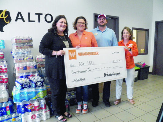 Photo by Michelle Dillon
Alto ISD Superintendent Kelly West, far left, accepts a $5,000 donation from Whataburger representatives Jennifer Ruiz, director; Brent Bolder, training manager; and Shelly Lipe, marketing director.