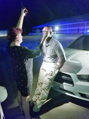 Photo by Josie Fox
Academy member Kim Beathard performs a field sobriety test on Rusk Officer Ronald Wherry.
