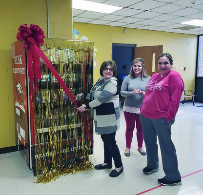 Photos by Josie Fox
From left, Rusk Elementary Library assistant Angela Corley, Assistant Principal Ashley Oliver and parent Kandi Wilkerson cut the ribbon to unveil Rusk Elementary’s new book vending machine.