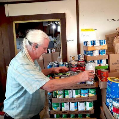 Murray Smith, director of Rusk’s Good Samaritan Food Pantry, helps stock donations for future use. According to Good Samaritan officials, the impact of a national pandemic has hit organizations like them hard.

Photo by Jo Anne Embleton