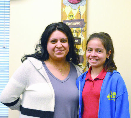 Placing second in the 2018 conservation poster contest was Dafne Lara, age 10, a fourth grader at Joe Wright Elementary in Jacksonville. She is pictured with teacher Maria Galvan.