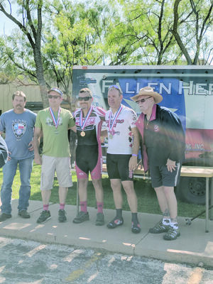 Lance Slack, gold medal winner of the time trial (center) at the Police Games in Abilene, poses with (from left) local event coordinator, Lt. Joe Tauer of Abilene, bronze medalist David Atkins of the Austin PD, silver medalist Jay Swann with Taylor County Sheriff’s Office and state coordinator, retired San Antonio Sgt. Neal Mitchell.