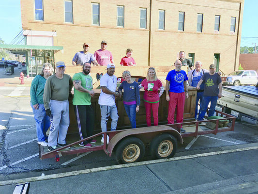 Photo Provided by Heritage Center of Cherokee County
Volunteers pose with the disassembled soda fountain bar as they prepare to transport it to its new home at the Heritage Center of Cherokee County in Rusk. The historic bar will be on display during the Christmas Tour of Homes.