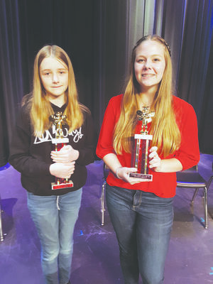 Photo by Cristin Parker
Elizabeth Arrington, right and Kaylie Martin show off their trophies after participating in the 2020 County Spelling Bee.