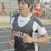 Tony Torres of Rusk runs the 3,200-meter run at the Doug Jordan Relays. Torres placed third in the event, contributing to Rusk's second place showing in the boys varsity division of the track meet.