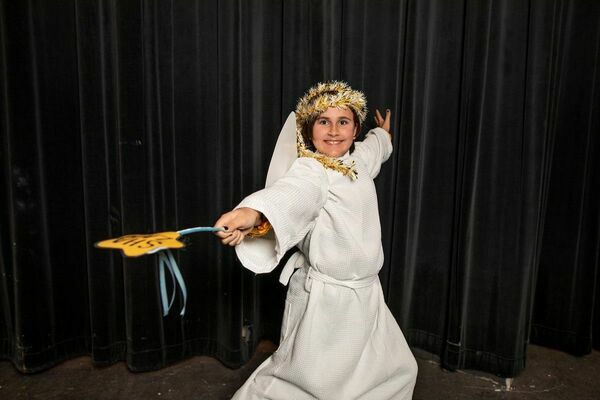 Emery Norman, as Gladys Herdman, wields the Christmas spirit as the Angel of the Lord.