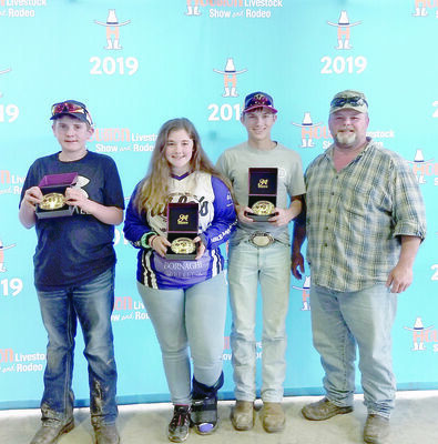 From left, Clay Crushers members Matthew Young, Cassie Loden and John Snider with Club Manager Gregg Loden, show off their shooting awards.