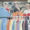 Rusk Eagle football players (from left) Mickey Lloyd, Dustin Crosby and William Edwards check out the sports shirts at Knox Ray Mens Wear in Rusk just prior to the sales tax holiday.