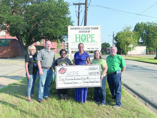 Photo by Jessica Payne
Pictured from left, are Jacksonville Chamber President Peggy Renfro, Vance Royon, Janis Adams, HOPE Administrator Ellann Johnson, Pam Anderson and Dale Jamerson.  The group shows off the donation the Chamber recently presented to HOPE.