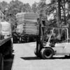 A forklift operator l from Ore Trans unloads cubicle furniture from a flat bed trailer at the Rusk Civic Center. The cublicle furniture was purchased by the Rusk Economic Development Corporation for Etech, Inc.