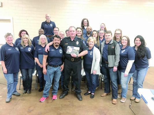 Photo by Megan Dover
Chief Joe Williams, center, poses with members of the first Rusk Citizens Police Academy following their graduation ceremony on 
Tuesday, Feb. 26. 
After receiving their diplomas, the class presented the chief with a plaque of 
appreciation and commendation bar for ‘outstanding community 
service’.
