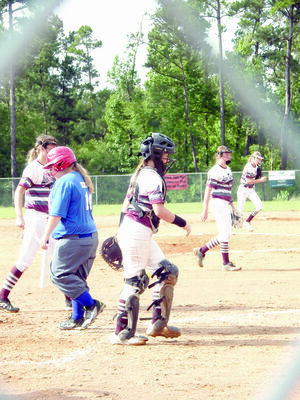 Photo by Cristin Parker
Team members of the Corsicana Lady Texas Rangers and the Lovelady Lion Drive conclude their match up during the 15U softball tournament going on this week at the Rusk Lion’s Baseball/Softball complex. The Lion Drive beat the Lady Rangers Monday morning, 16-0.