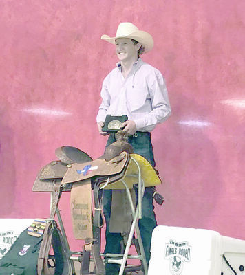 Dement shows off his winnings after becoming the 2019 Texas Bareback Bronc Riding champion.
