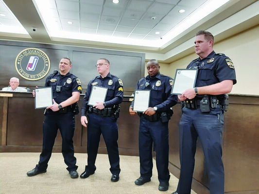 Photo by Michelle Dillon
From left, Jacksonville Police Department Sergeants Randy Wilson and Steven Markasky, and Officers Quincy Hamilton and Benton Brumit show off their ommendations during a recent council meeting.