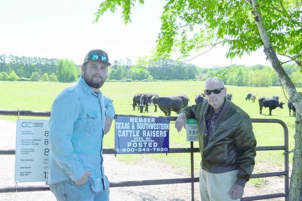 Tanner Ezell (left) will be recognized as an Outstanding Conservationist for his Cattle &amp; Hay Operation by Roland Adams (right), director of zone 2 of the Cherokee County Soil &amp; Water Conservation District #427.