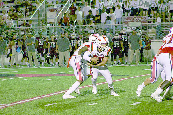 Photo courtesy of Tara Tatarski
Alex Jones (pictured) receives a handoff during Friday’s game against at Athens. Jones had a four-yard rushing touchdown against the Bears.